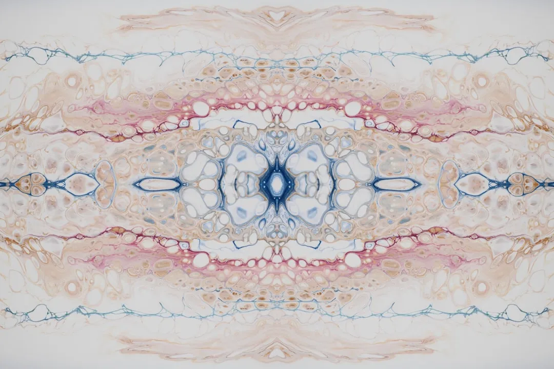 an abstract image of a blue and pink flower