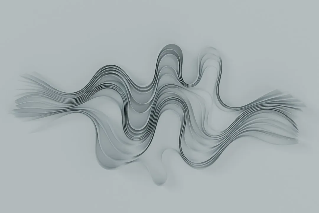 A gray and white abstract background with wavy lines