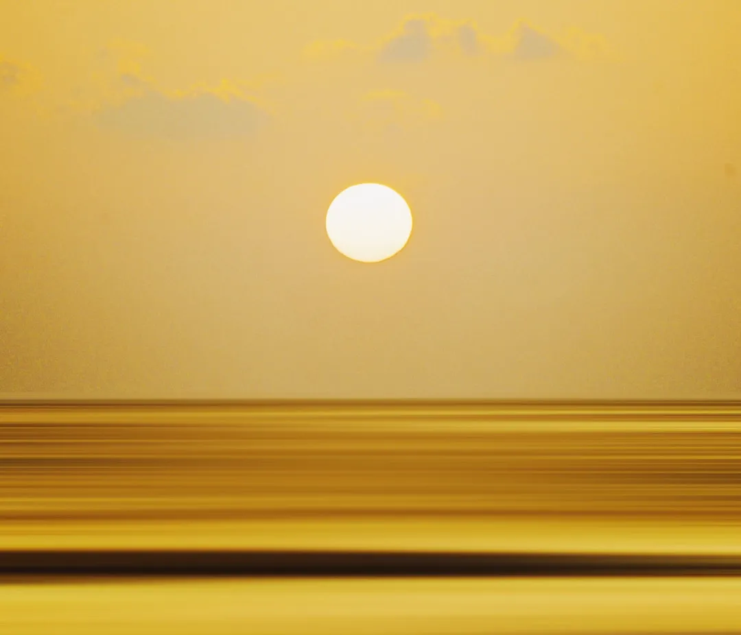 a sunset over a beach