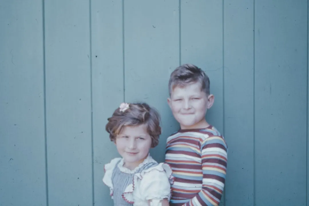 2 boys in blue and white striped long sleeve shirt