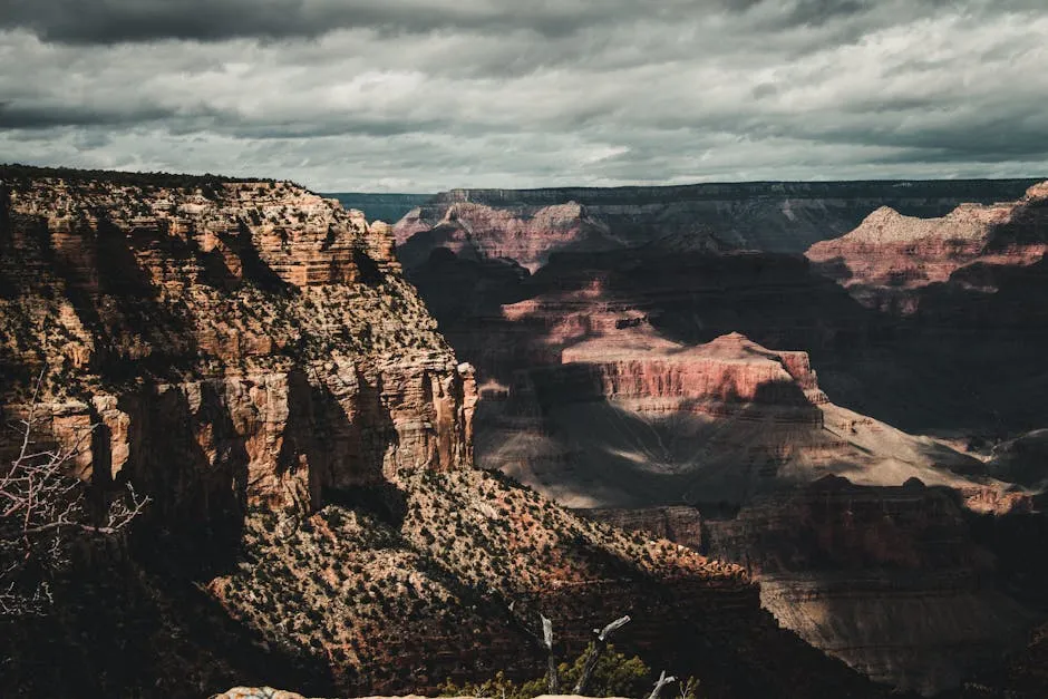 Capture of the Grand Canyon showcasing dramatic cliffs and cloudy skies.