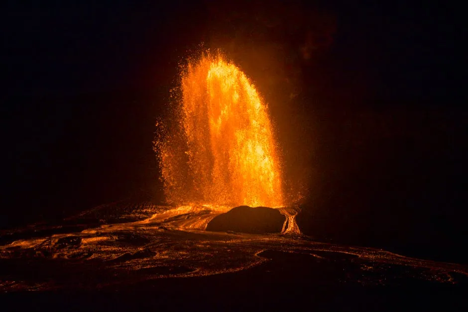 Stunning night capture of a fiery volcanic eruption in Hawaii with glowing lava.