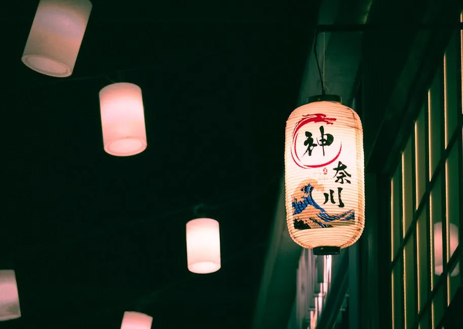 Japanese paper lanterns illuminate a dark urban night scene, creating a warm, cultural ambiance.